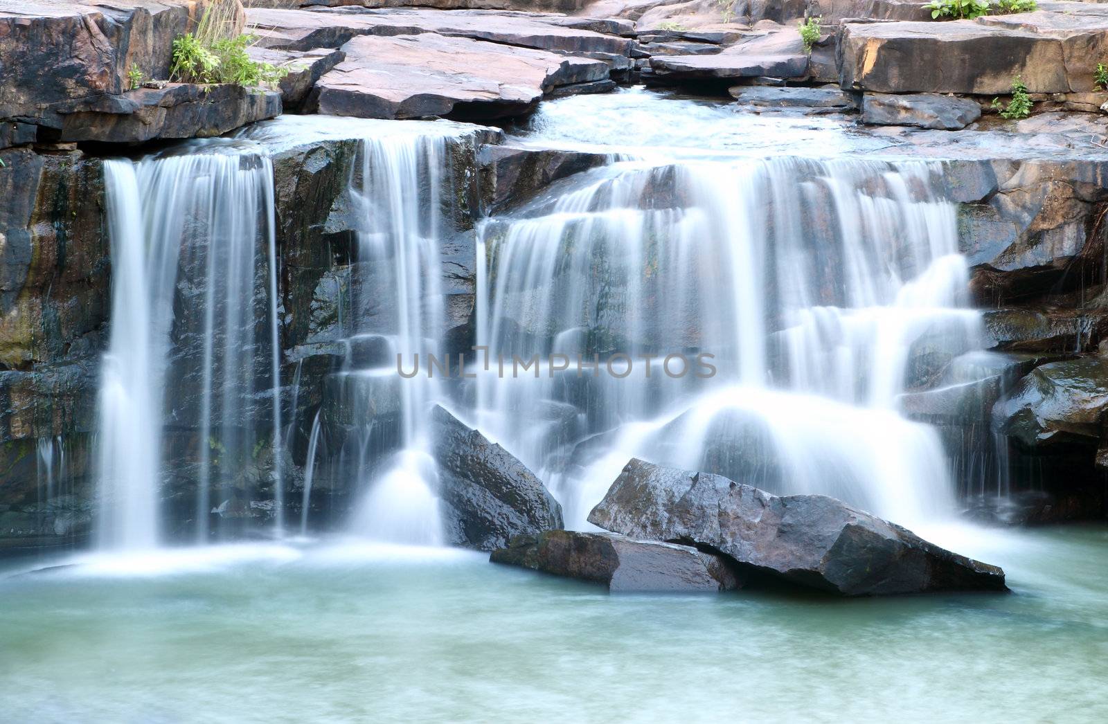 waterfall Tadtone in climate forest of Thailand top perspective by geargodz