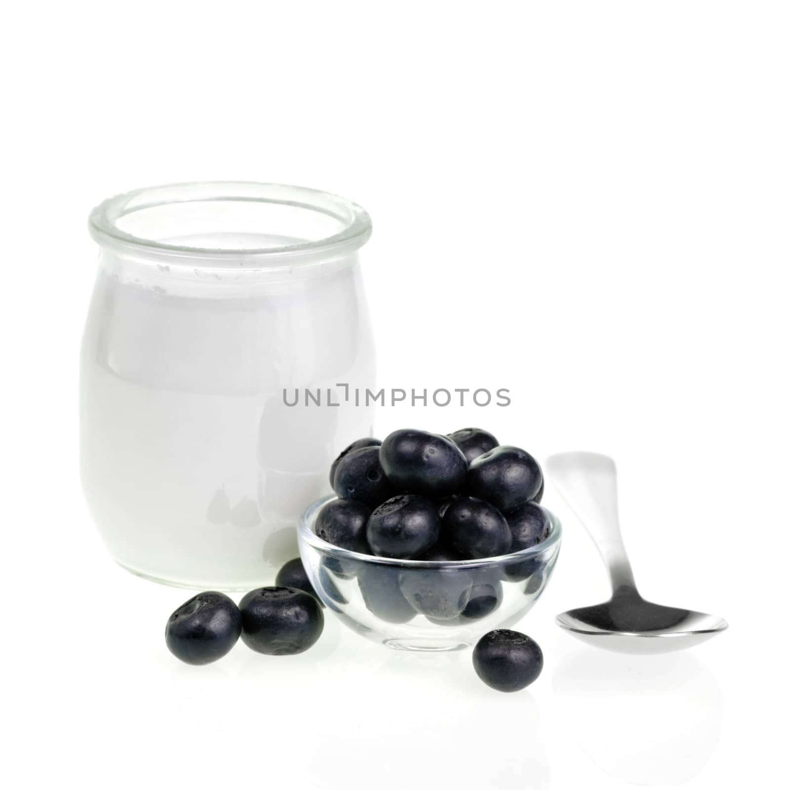Old-fashioned yogurt jar and Blueberries on white background