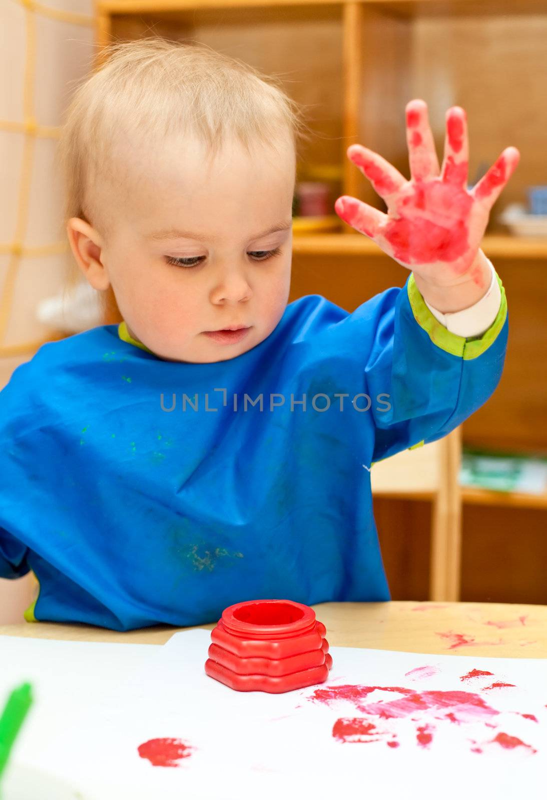 Little girl make finger paint