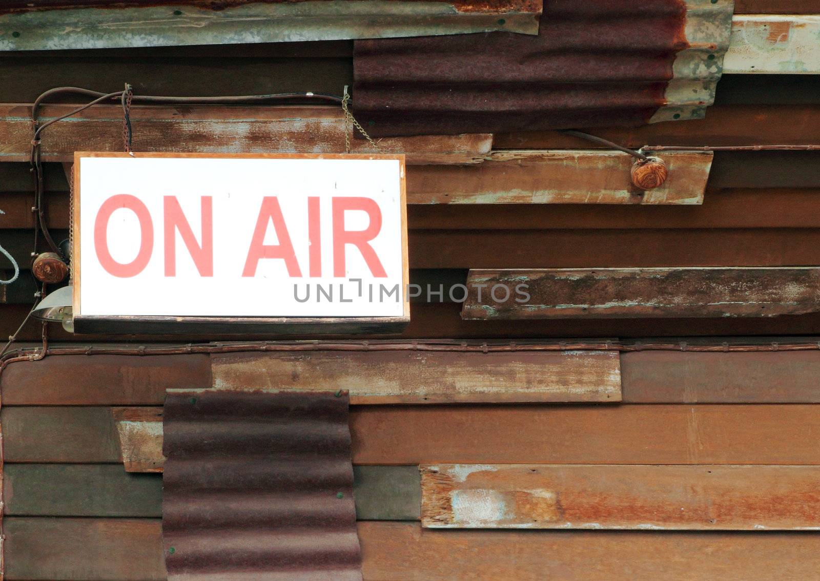 on air sign with old wall background