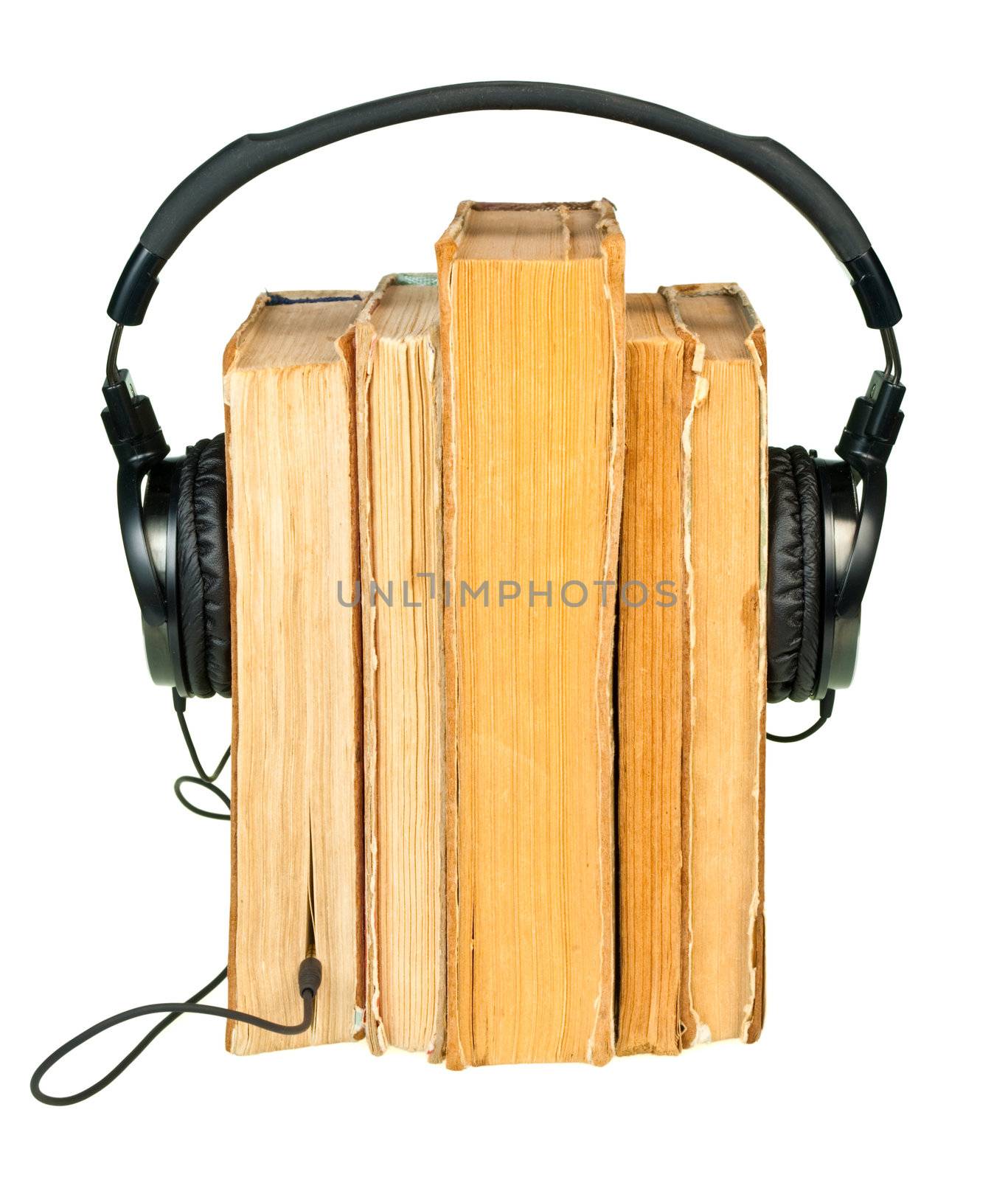 HI-Fi headphones on old books row isolated on white