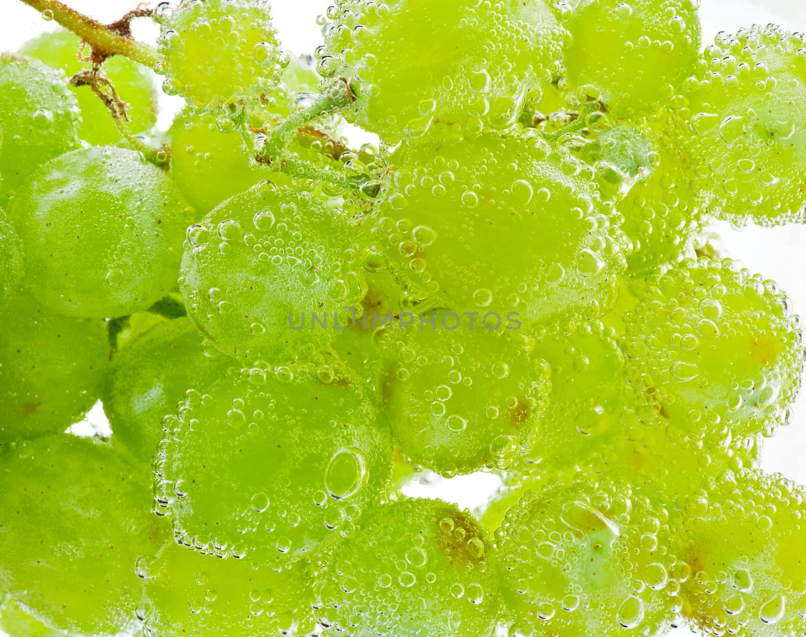 Grapes in water with bubbles