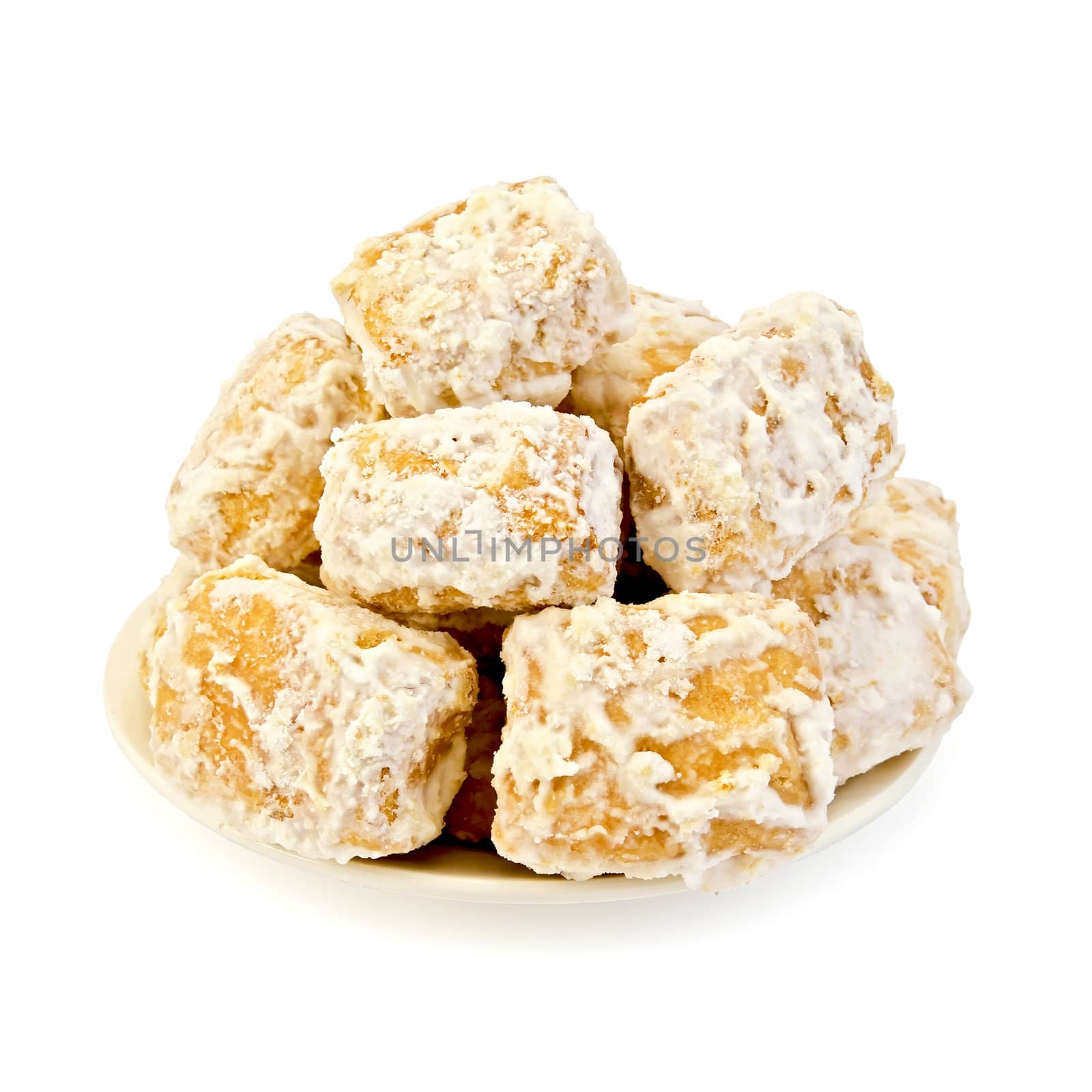 Biscuits in icing sugar on a plate isolated on white background