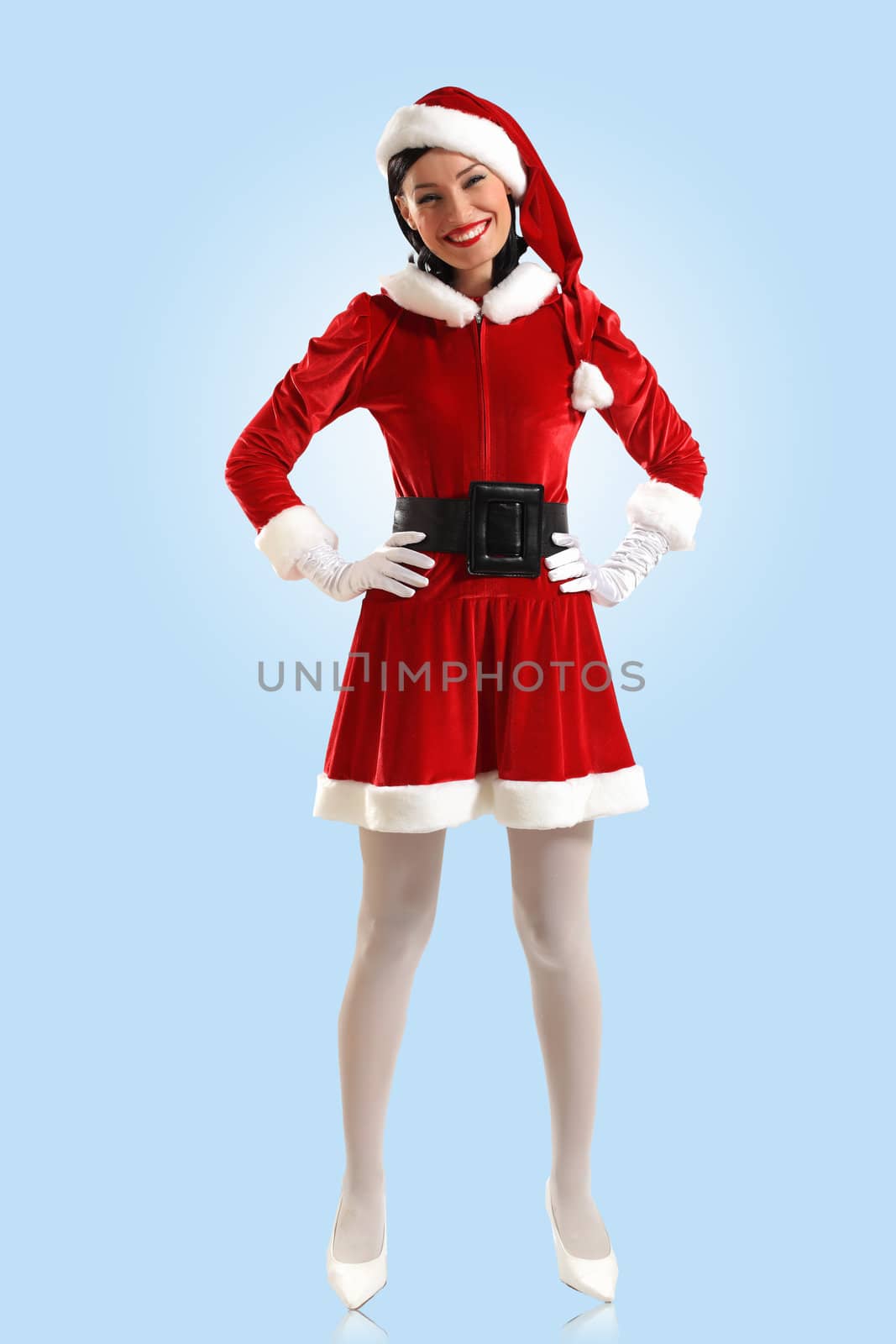 Portrait of beautiful young woman wearing santa claus clothes