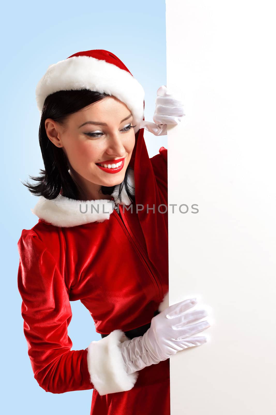 Portrait of a santa girl with a blank banner