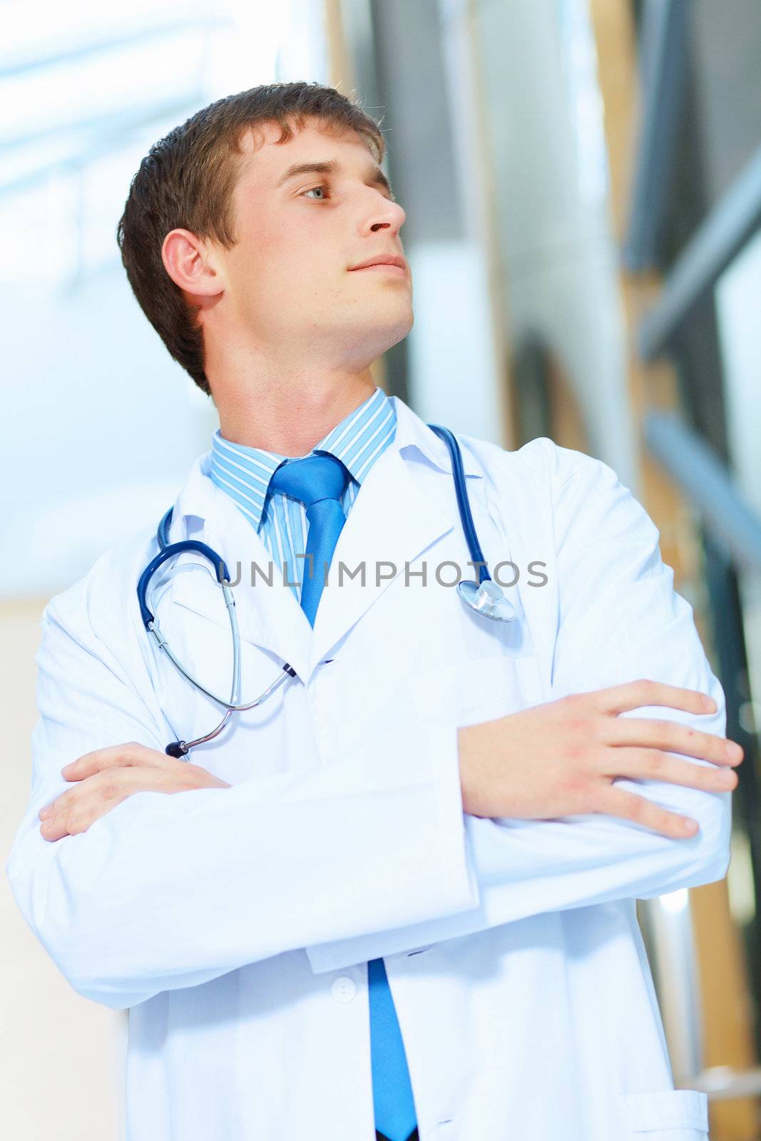 Portrait of friendly male doctor in hospital smiling