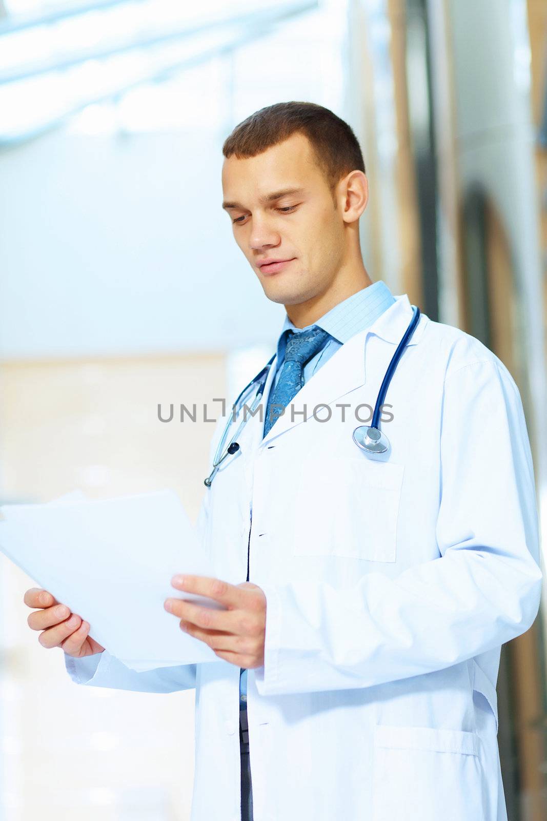 Portrait of friendly male doctor in hospital smiling