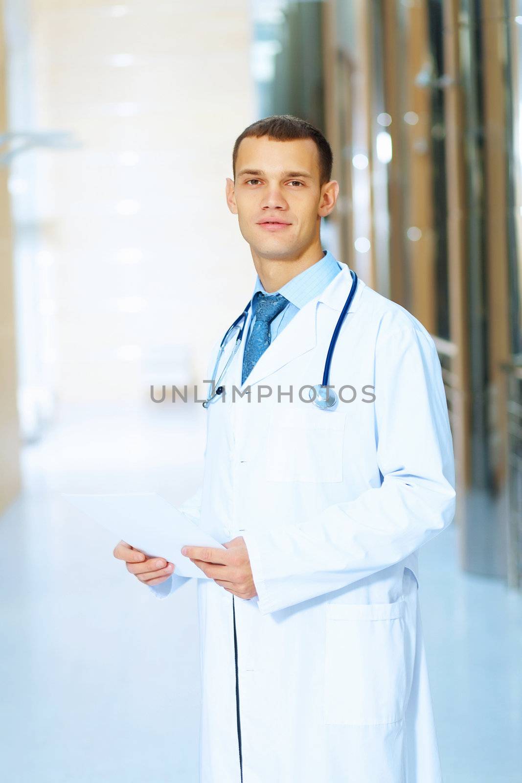 Portrait of friendly male doctor in hospital smiling