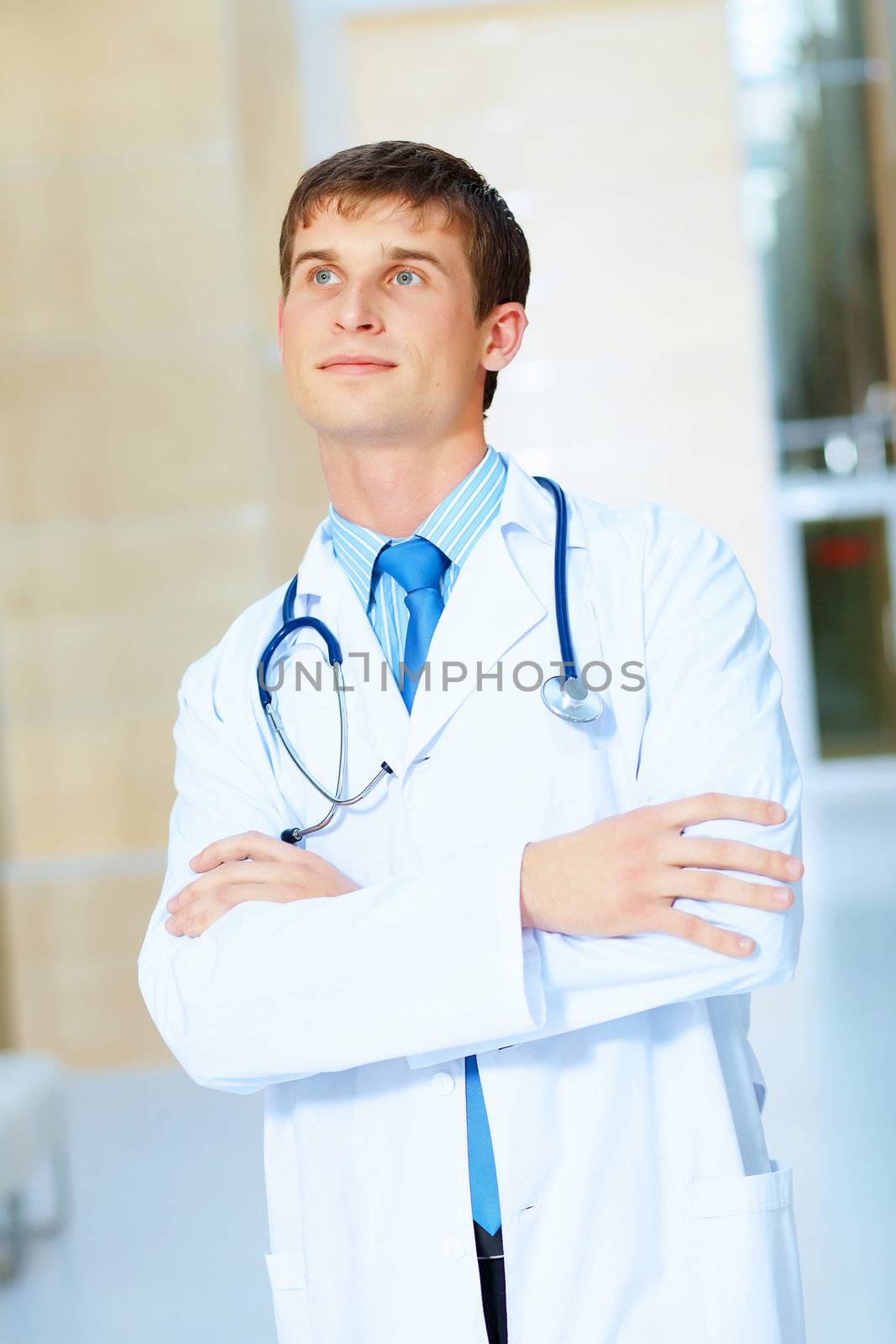 Portrait of friendly male doctor in hospital smiling