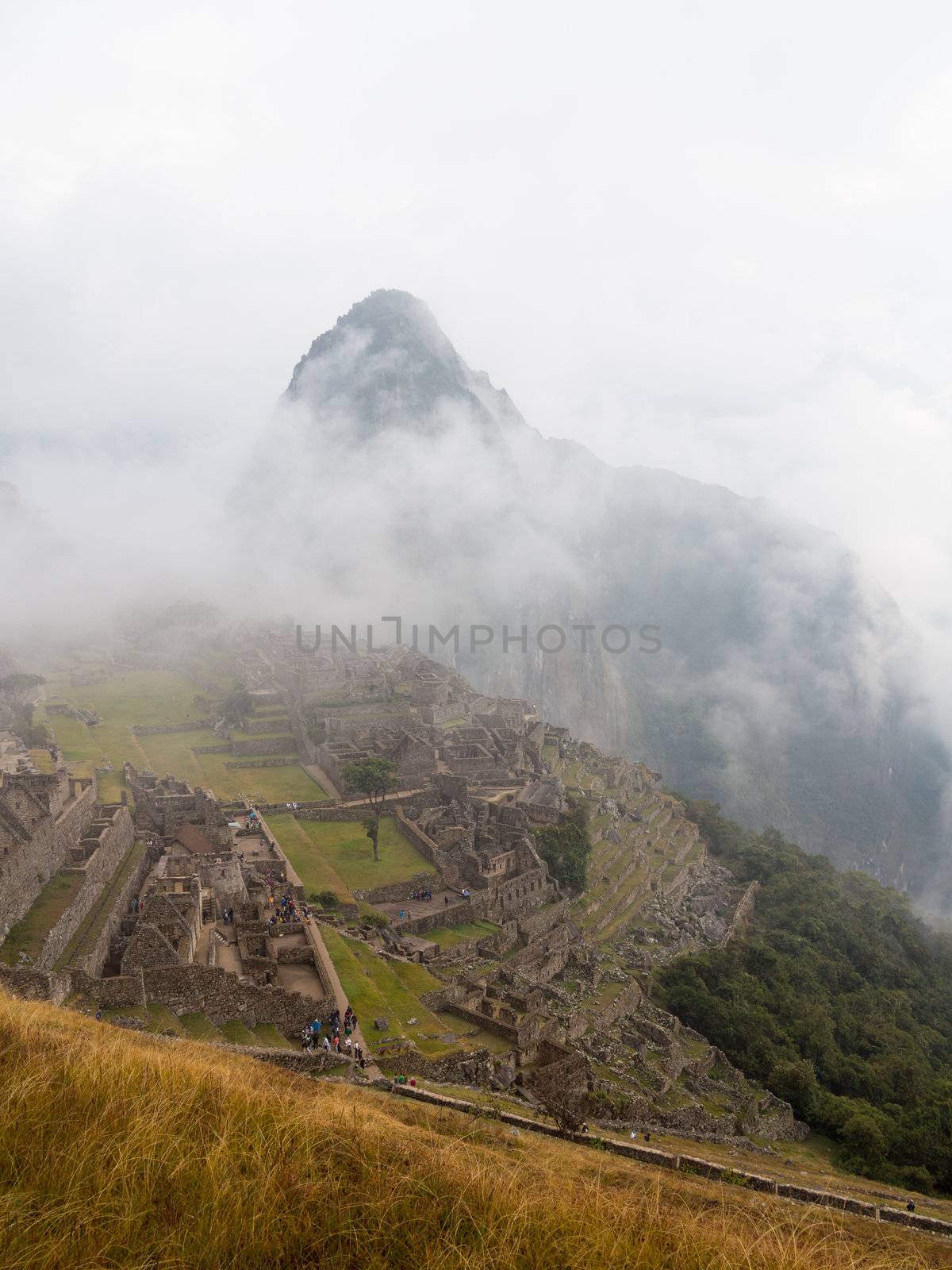 Morning views of Machu Picchu as mist clears from the mountainside