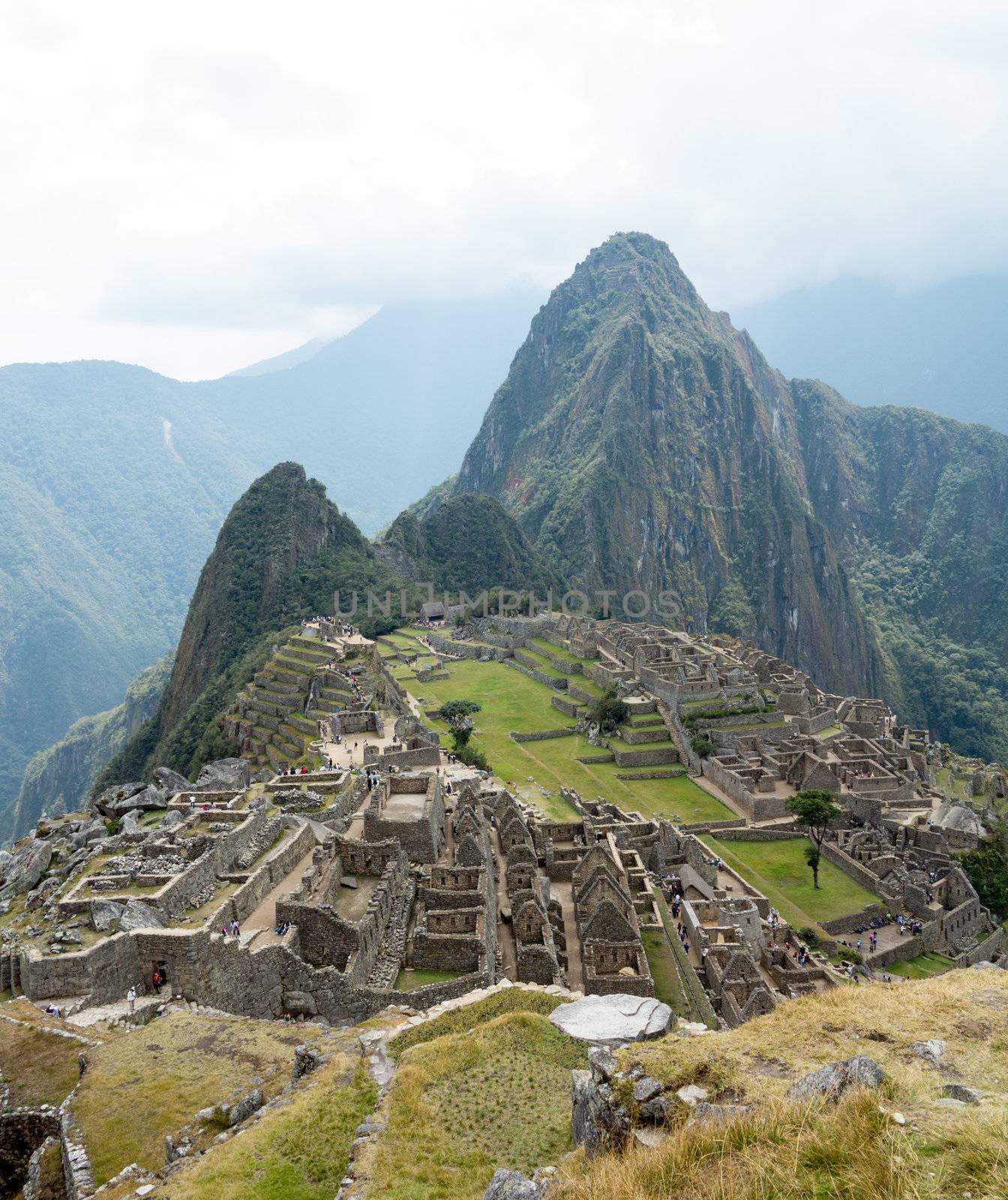Morning views of Machu Picchu as mist clears from the mountainside