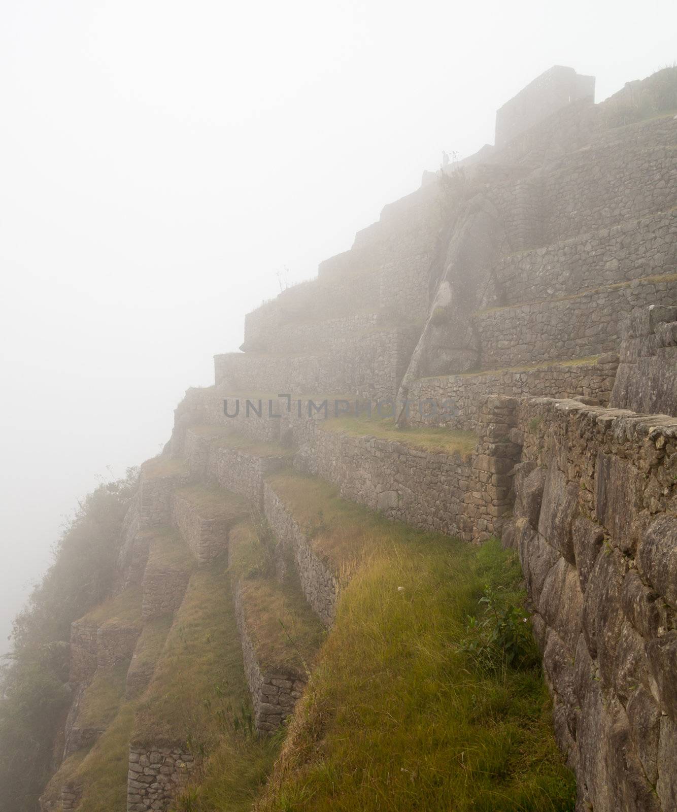 Morning views of Machu Picchu as mist clears from the terraces