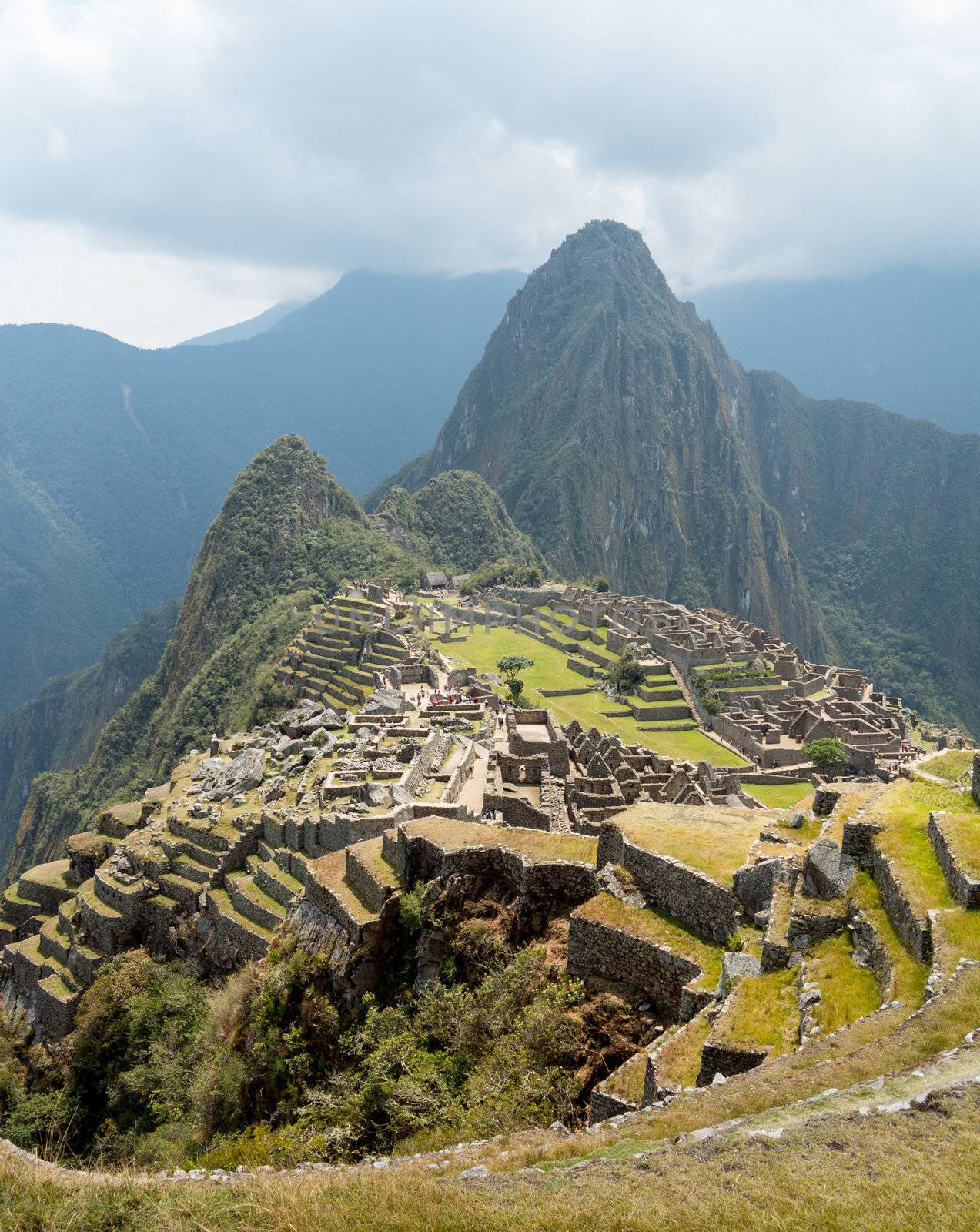 Morning views of Machu Picchu as mist clears from the mountainside