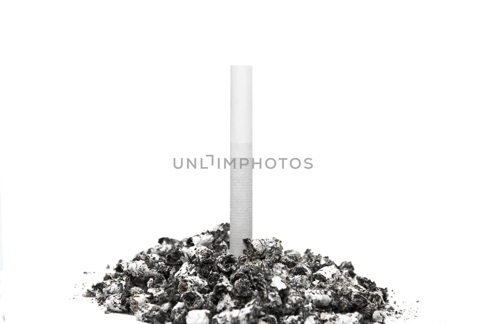 Cigarette stuck in a pile of ash on a white background.