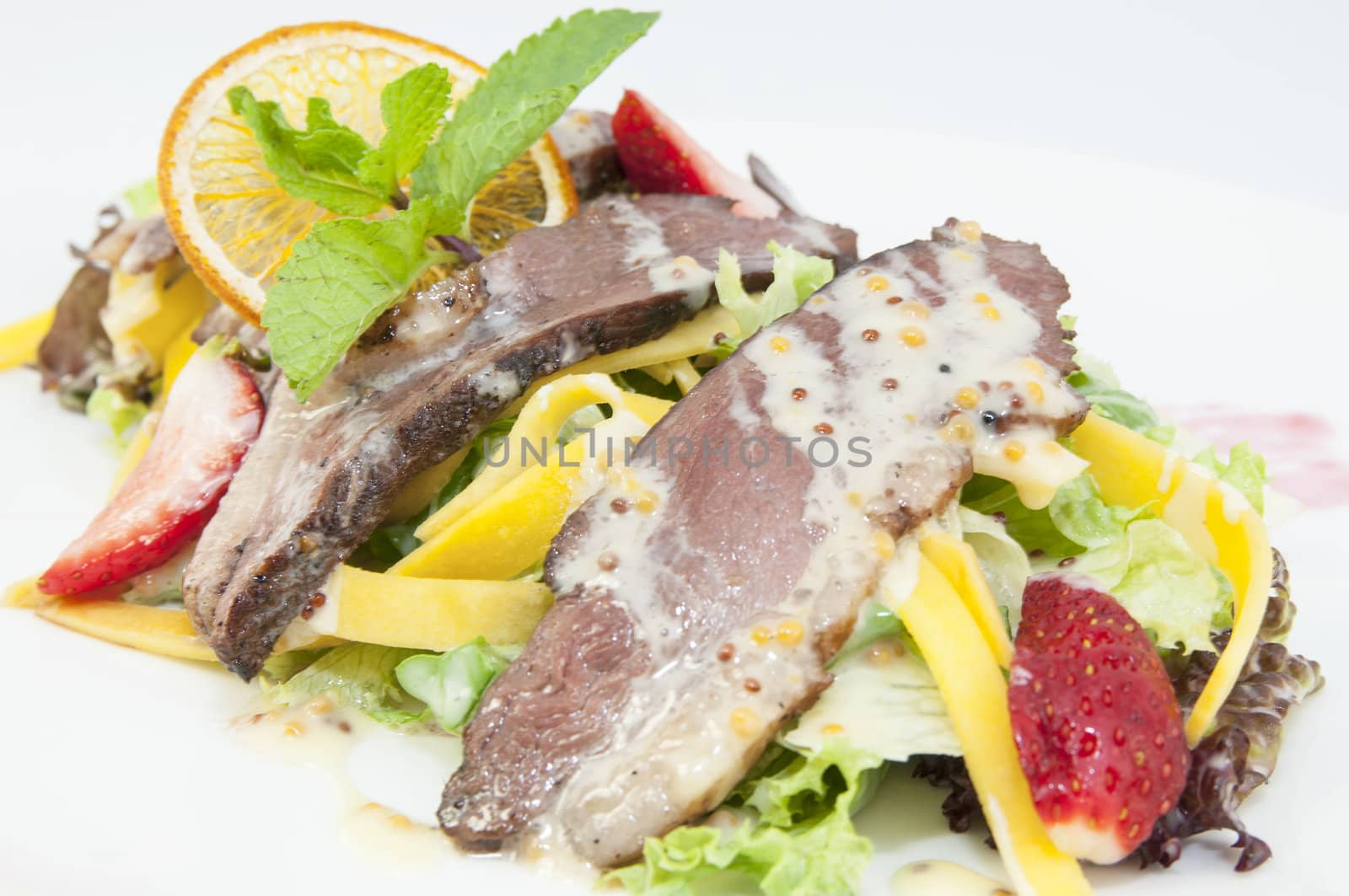 salad of duck meat and vegetables in a restaurant