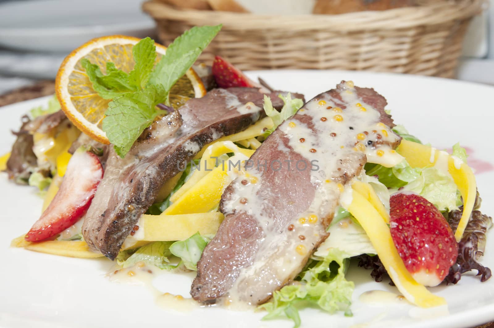 salad of duck meat and vegetables in a restaurant