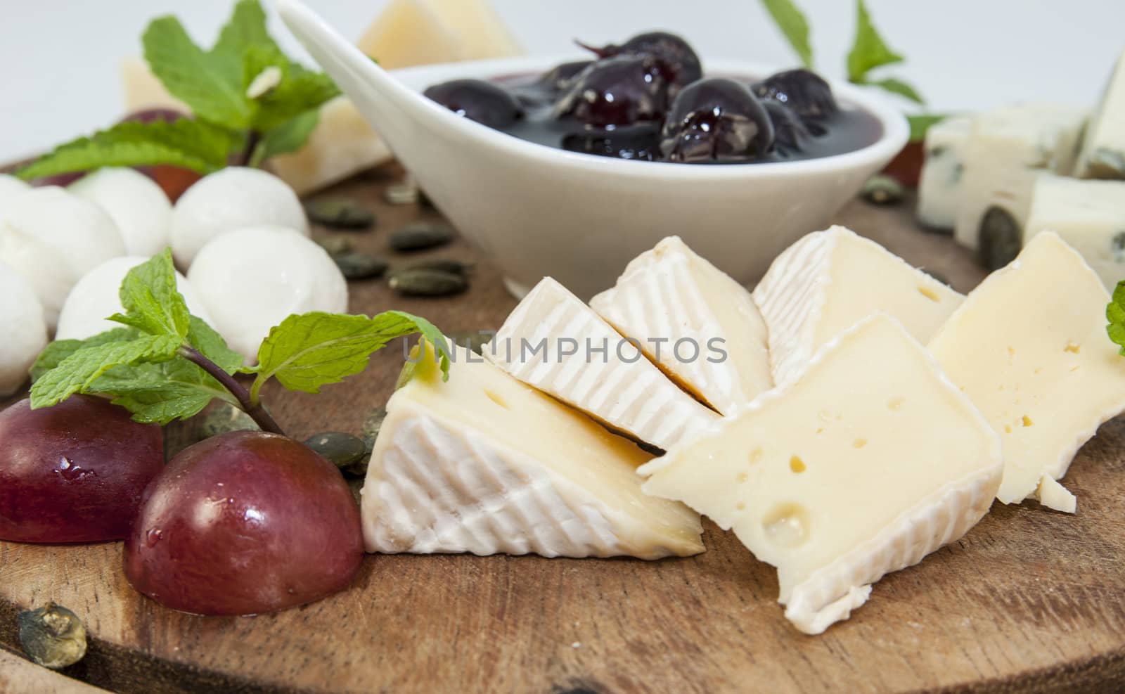 cheese plate with several varieties of cheese in the restaurant