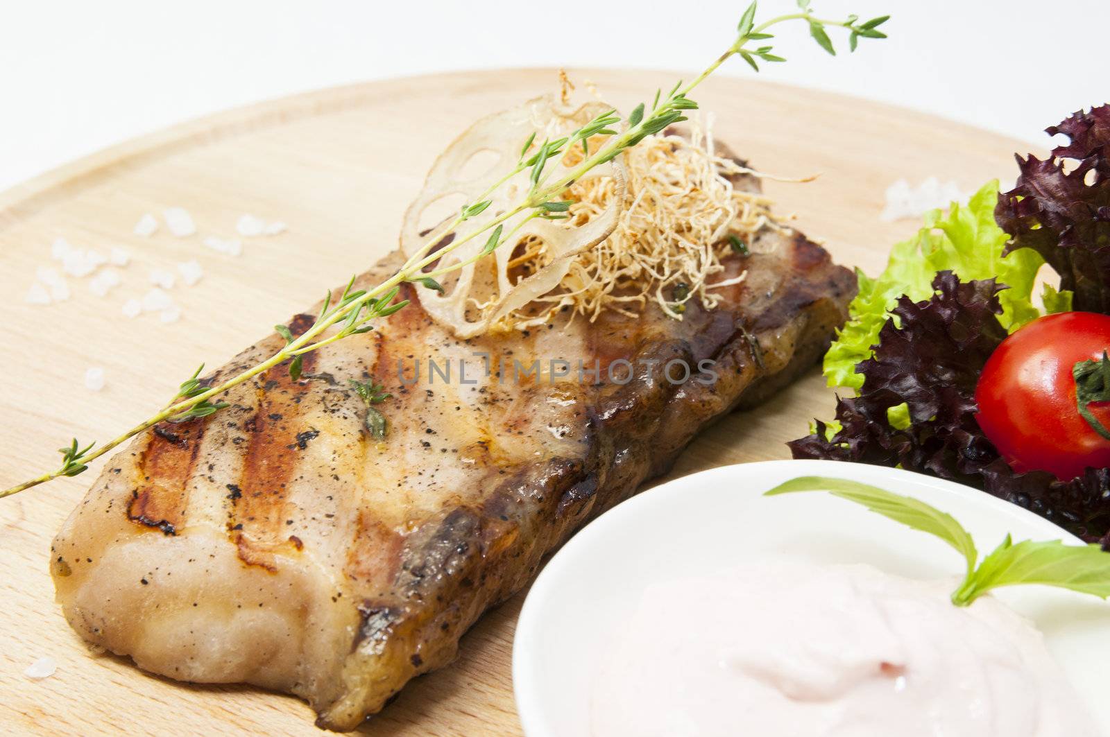 Catfish steak cooking on a grill in the restaurant