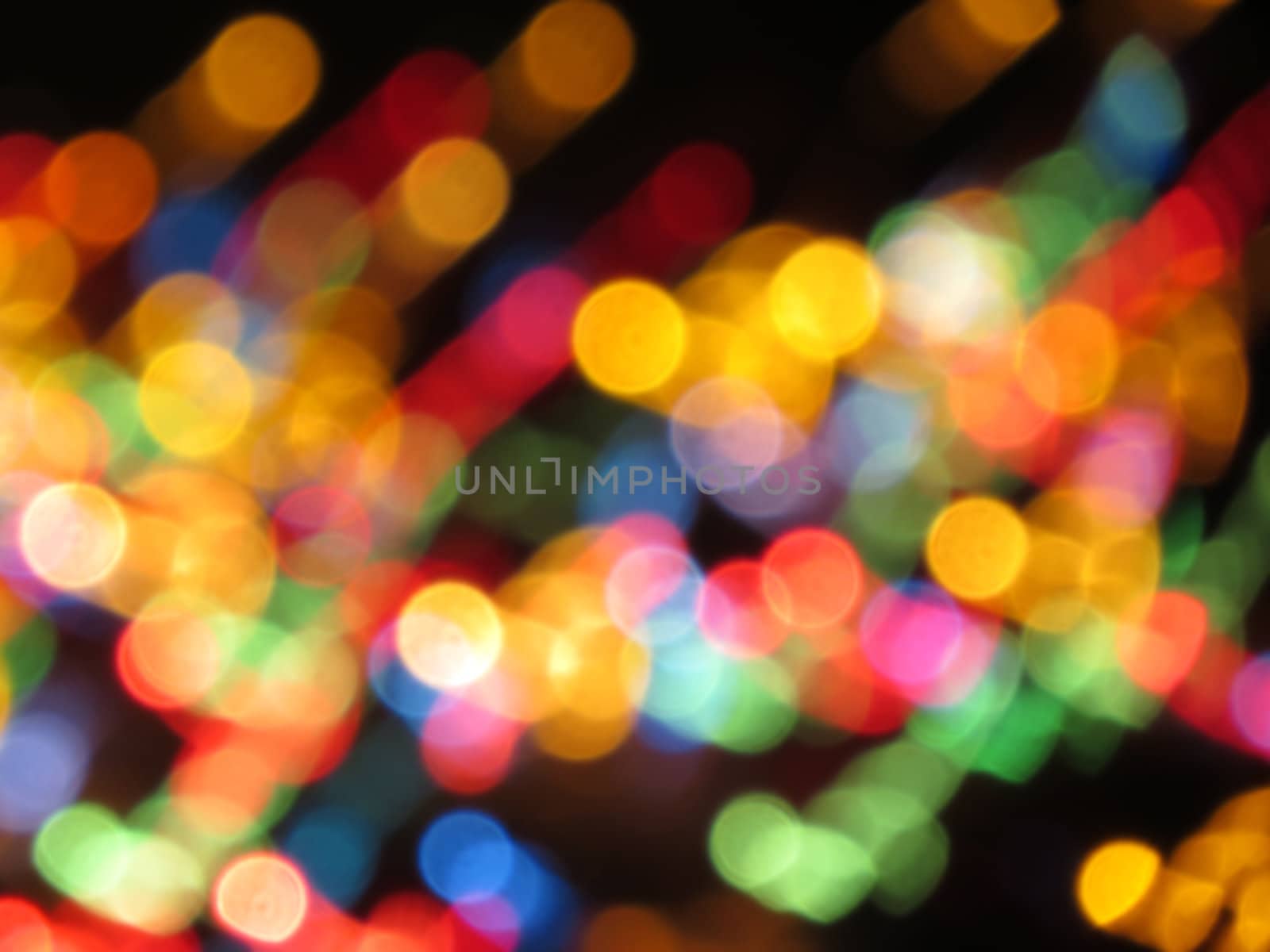 A background of colorful lights spread in an abstract pattern.                               