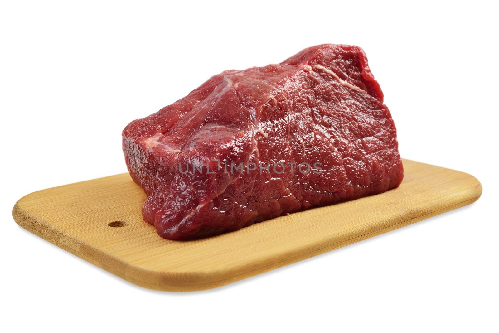 Beef on a wooden board. Isolated on white