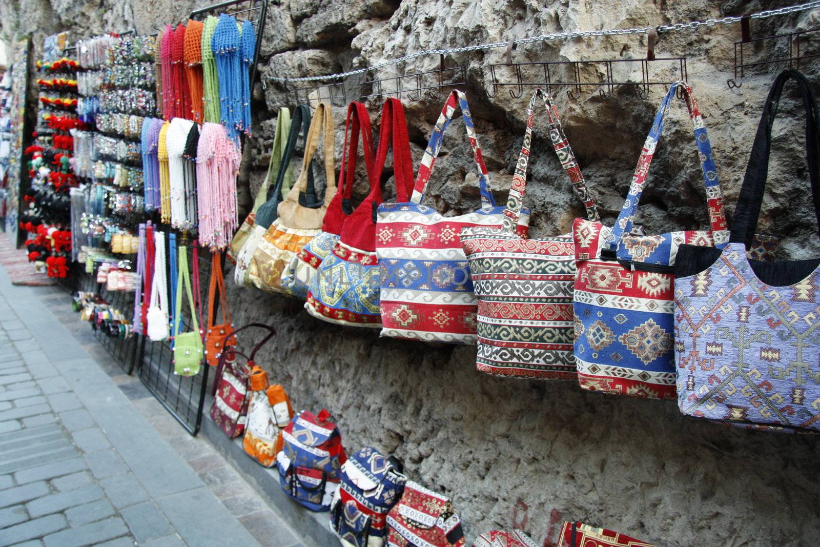 Colorful turkish bags and traditional souvenirs in oriental bazaar in Antalya, Turkey