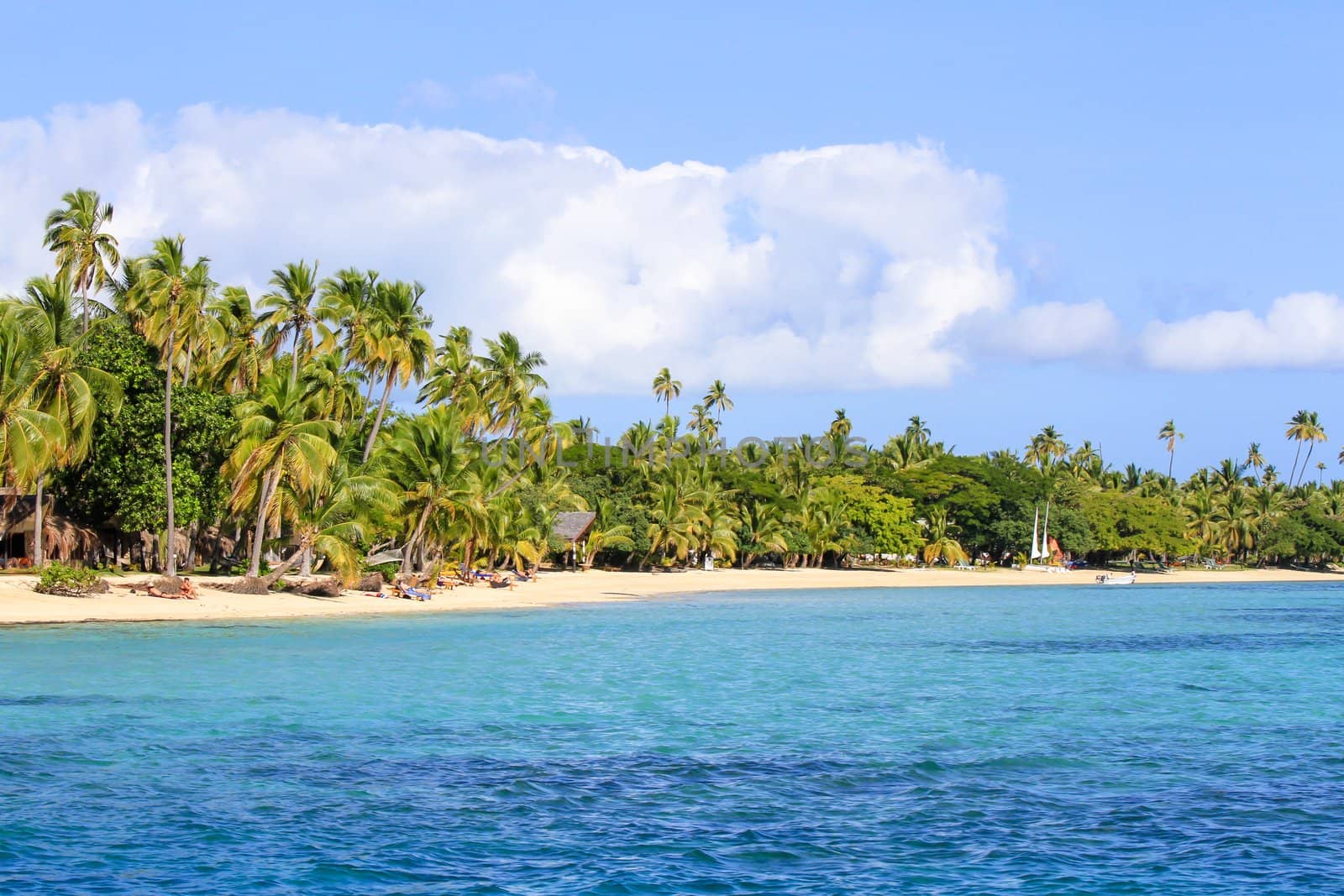 Beautiful Fiji atoll island with white beach in the middle of the ocean.