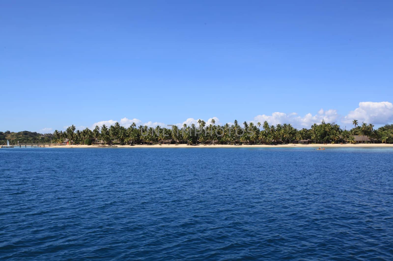 Beautiful Fiji atoll island with white beach by hangingpixels