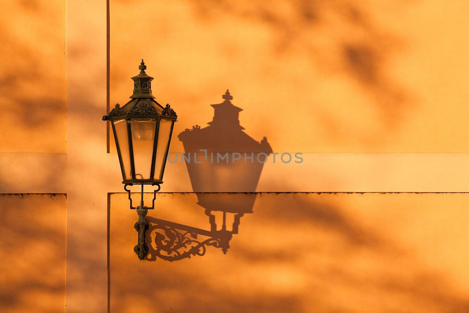 The lantern with its shadow on the yellow wall, Prague, Czech Republic