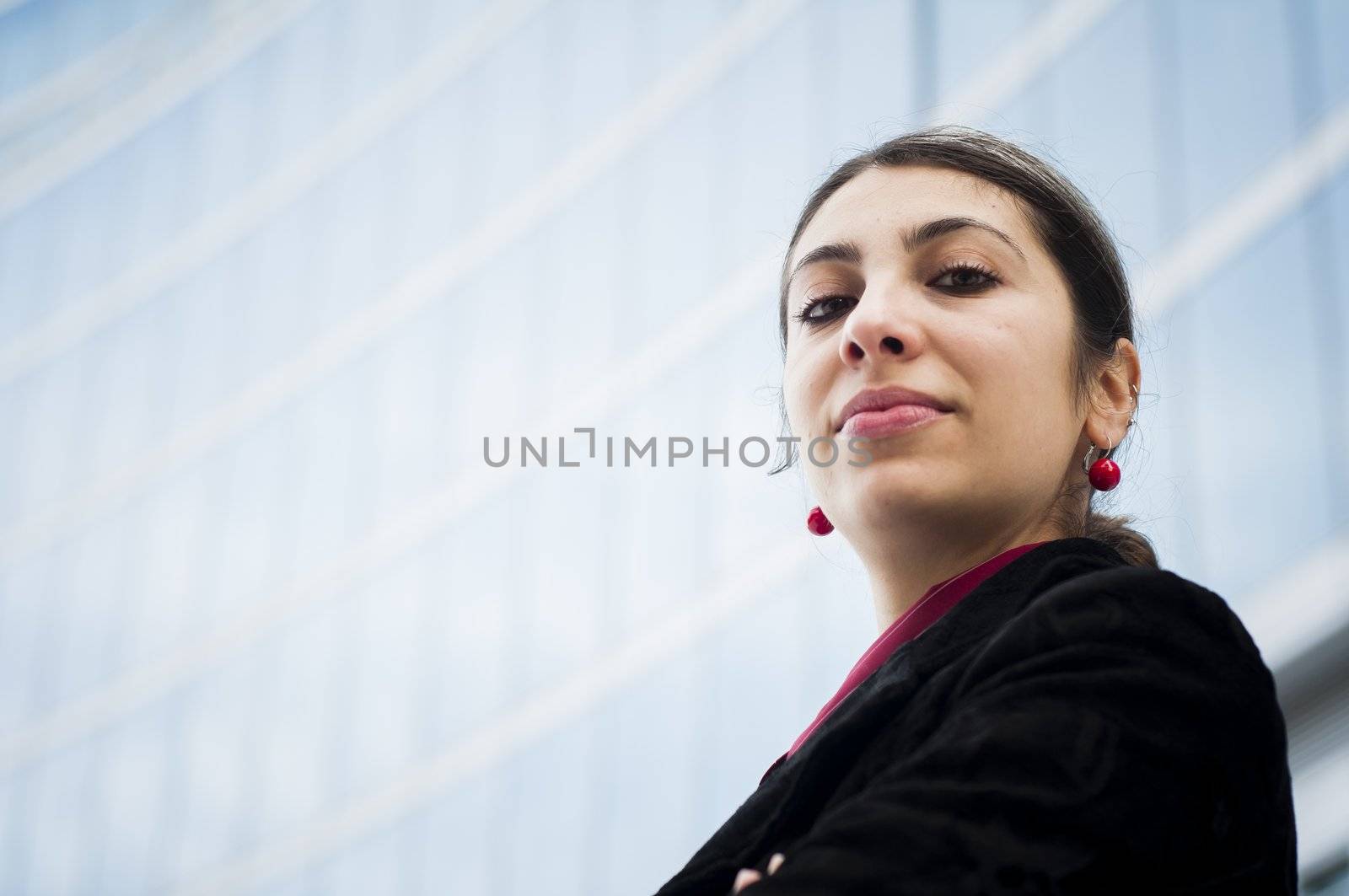 business girl in front of a modern building