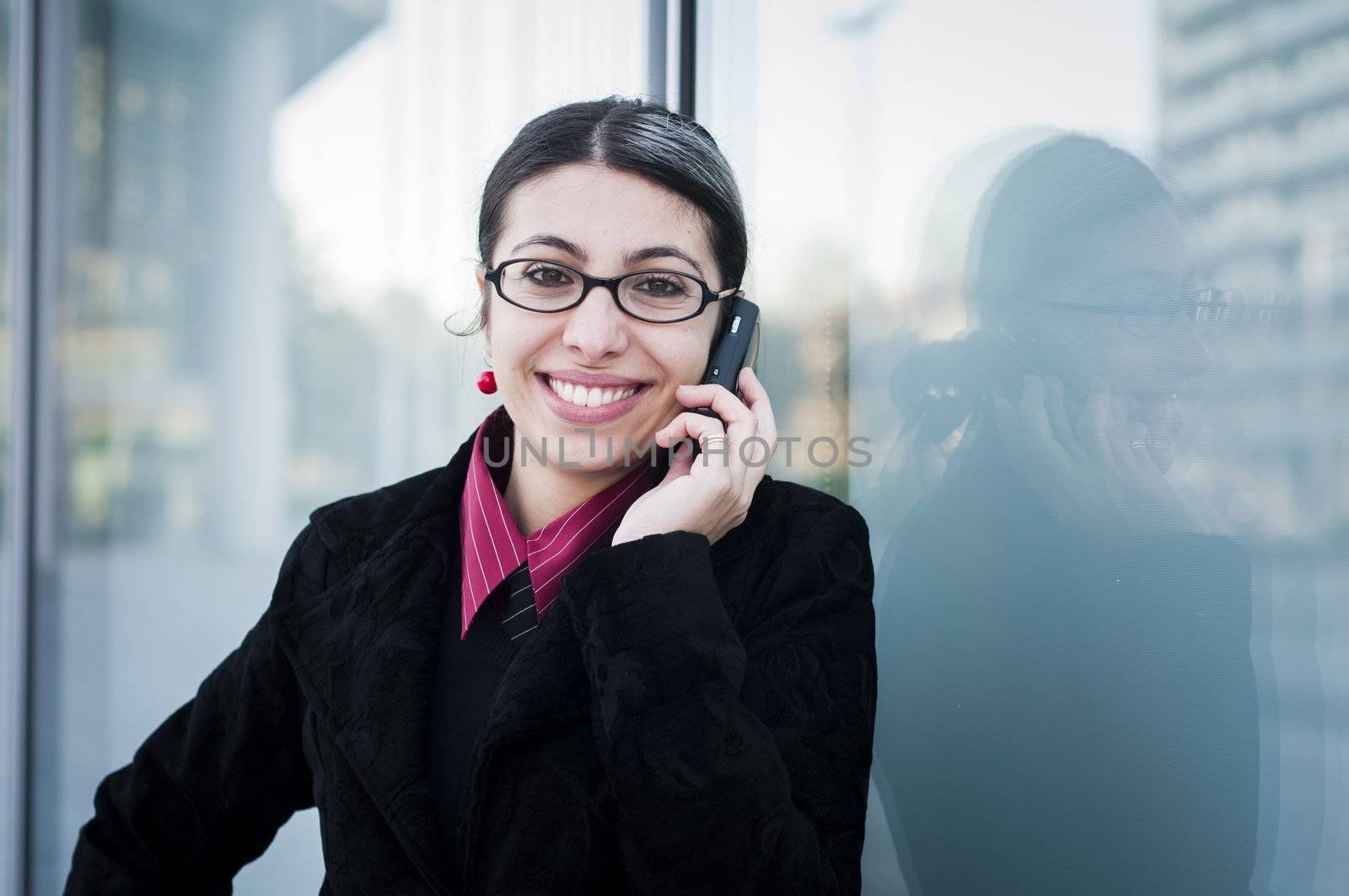 smiling business modern girl on the phone by peus