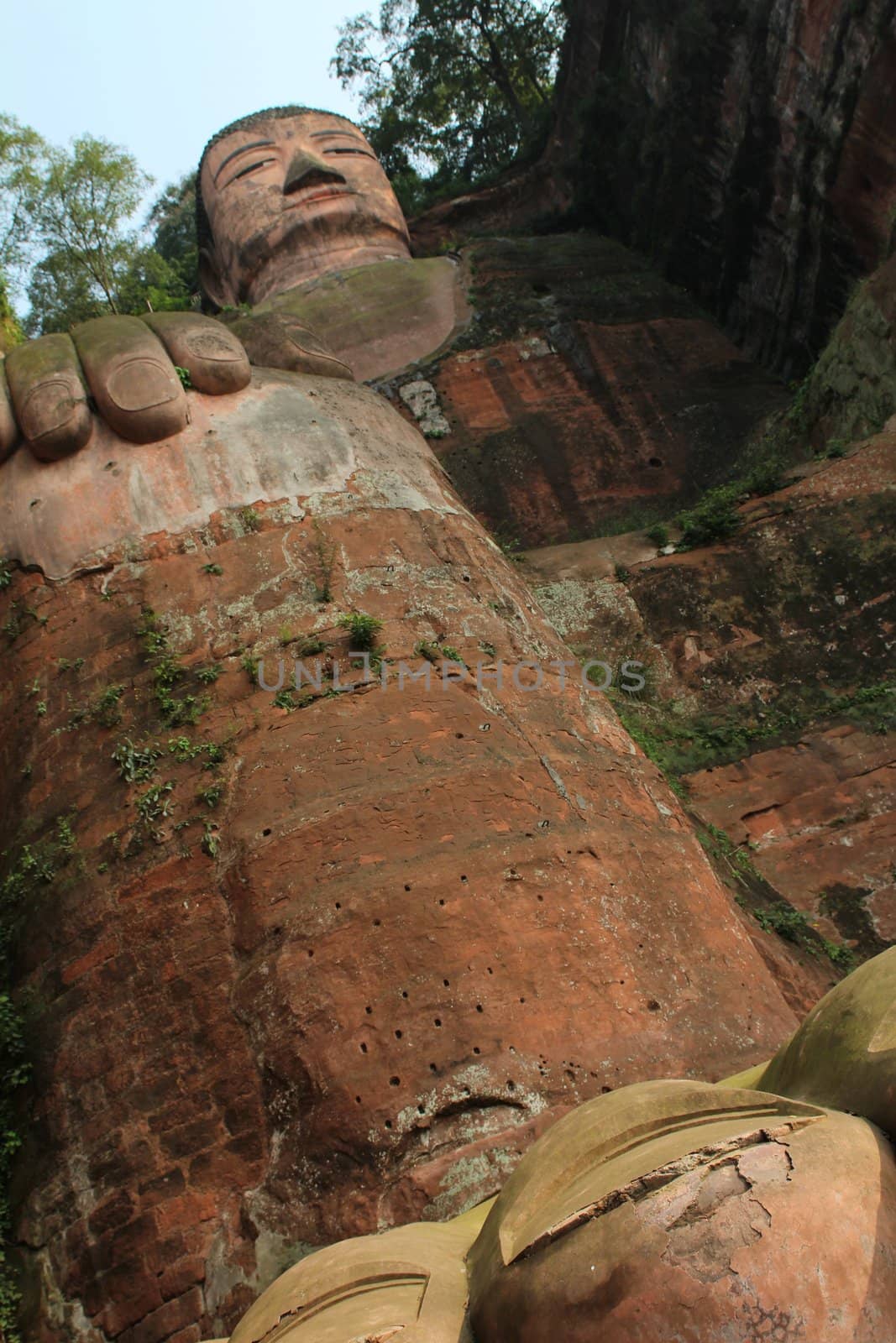 Leshan Giant Buddha, view from above. It is the largest stone Buddha in the world and it is by far the tallest pre-modern statue in the world. Leshan Giant Buddha Scenic Area has been listed as a UNESCO World Heritage Site since 1996.
