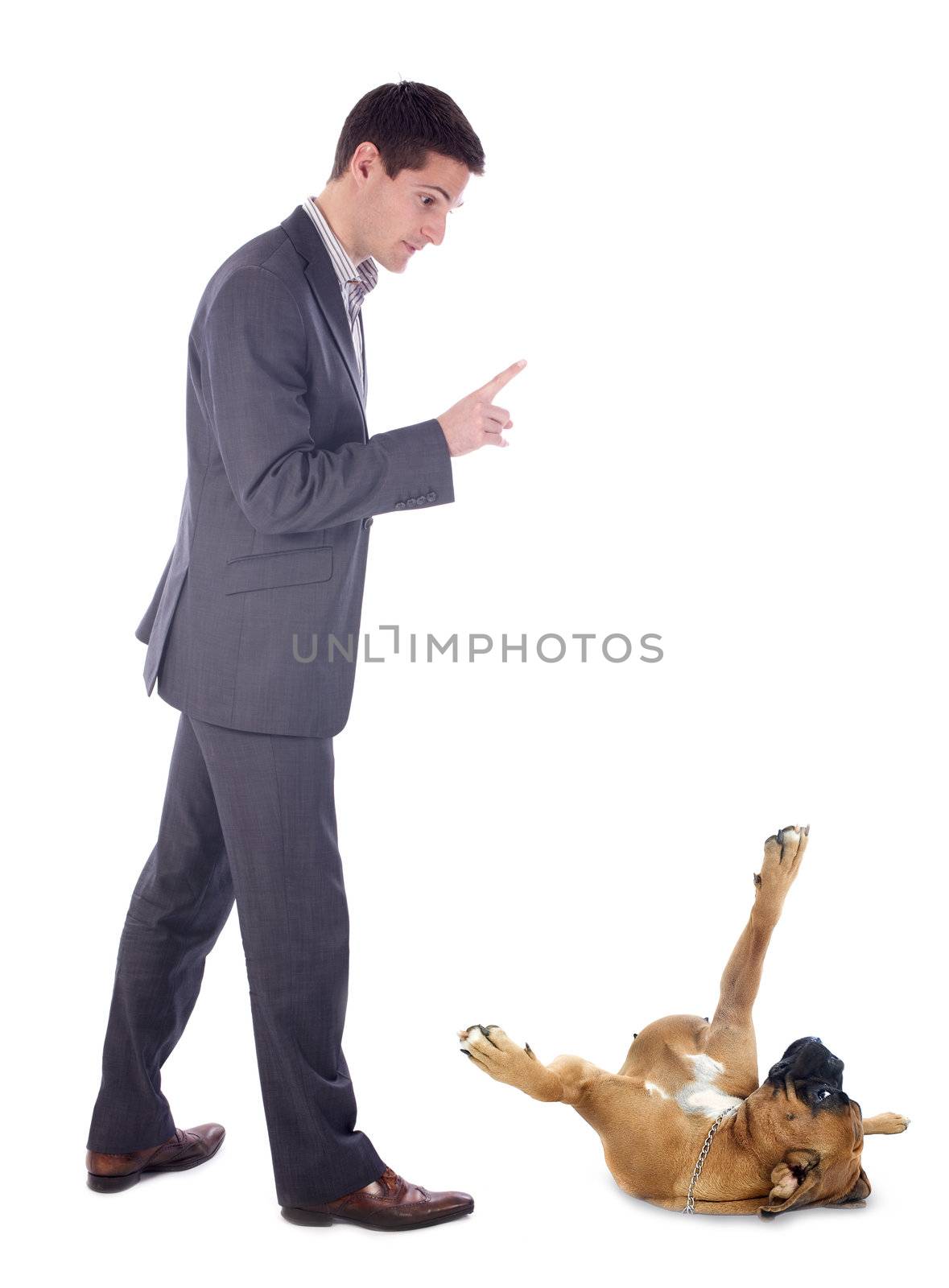 young man and his boxer in front of white background