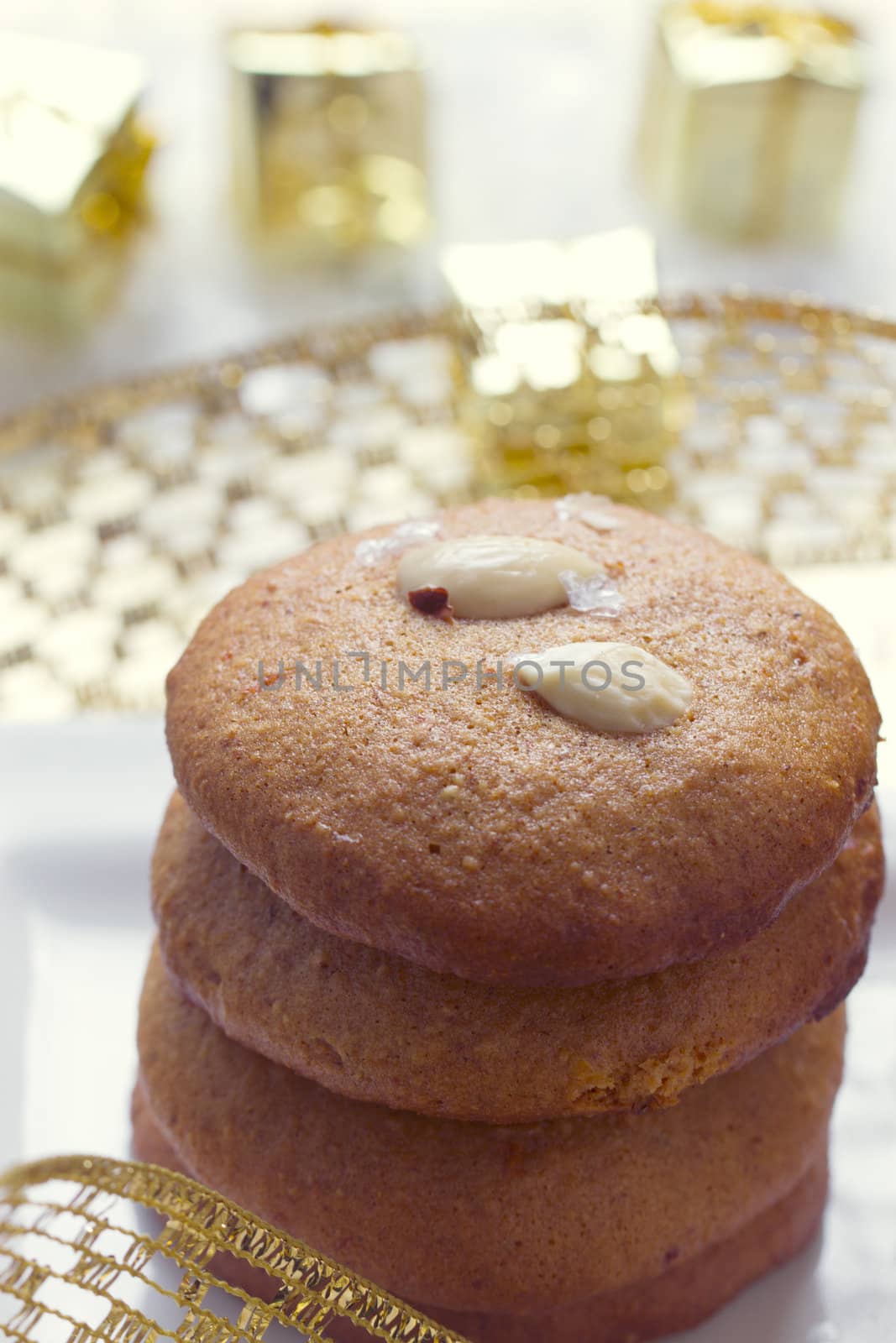 Cookies with nuts on the background of Christmas gifts