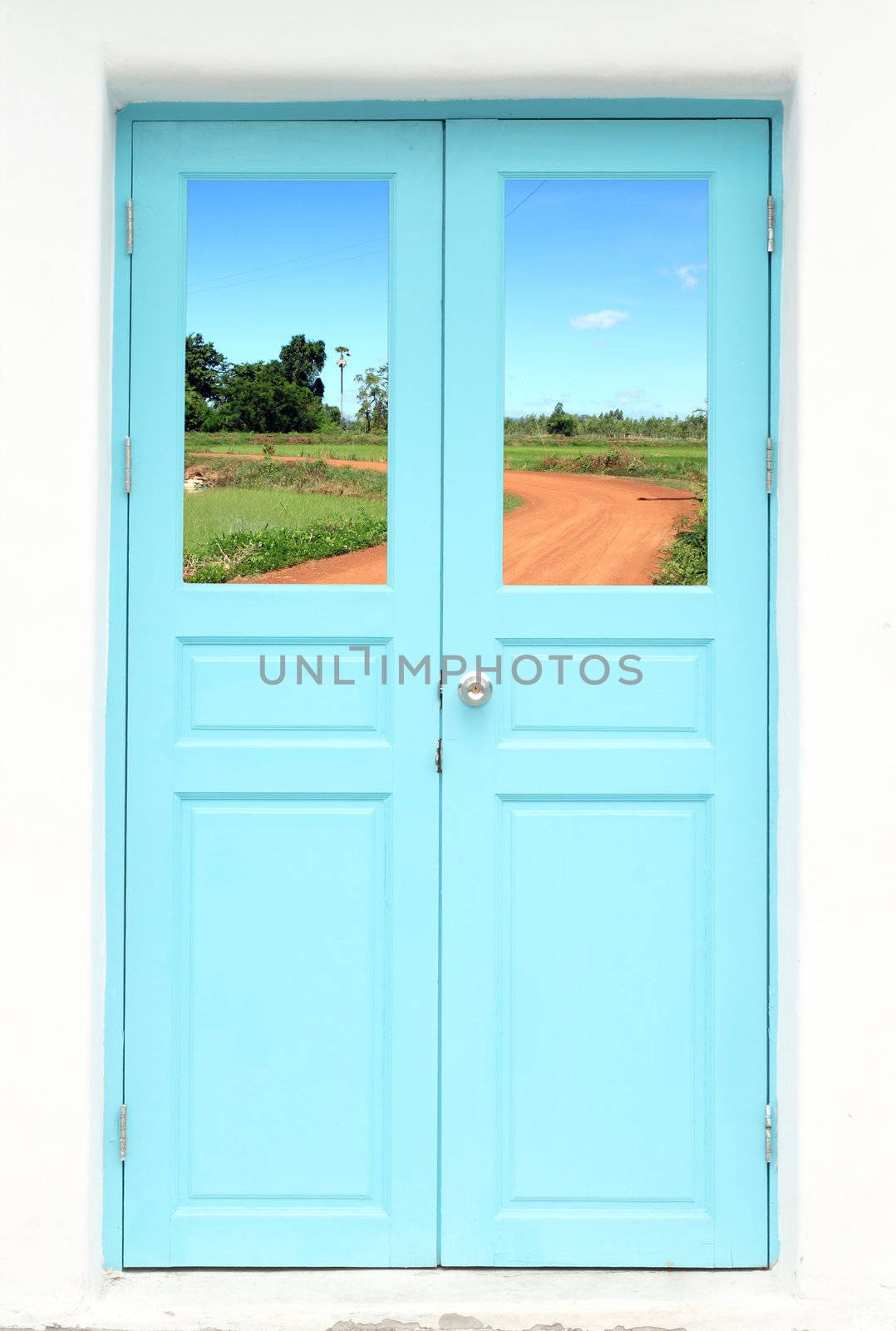 Greek style door with soil curve road view