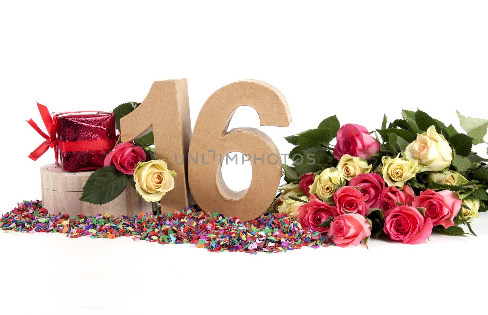 Number of age in a colorful studio setting with fresh roses on a bottom of confetti