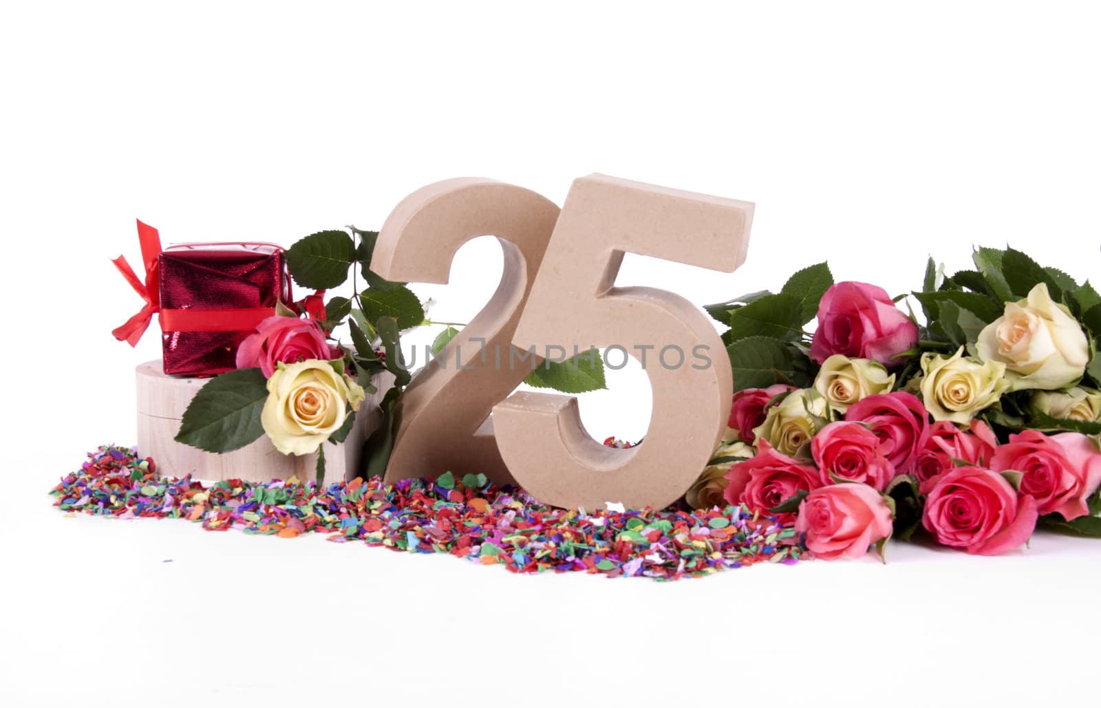 Number of age in a colorful studio setting with fresh roses on a bottom of confetti