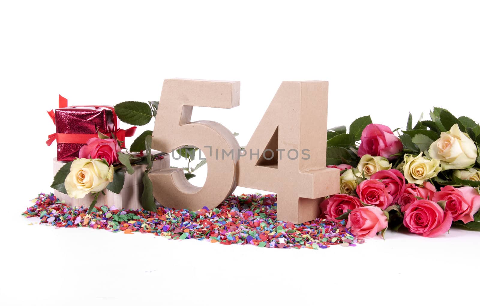 Number of age in a colorful studio setting with fresh roses on a bottom of confetti