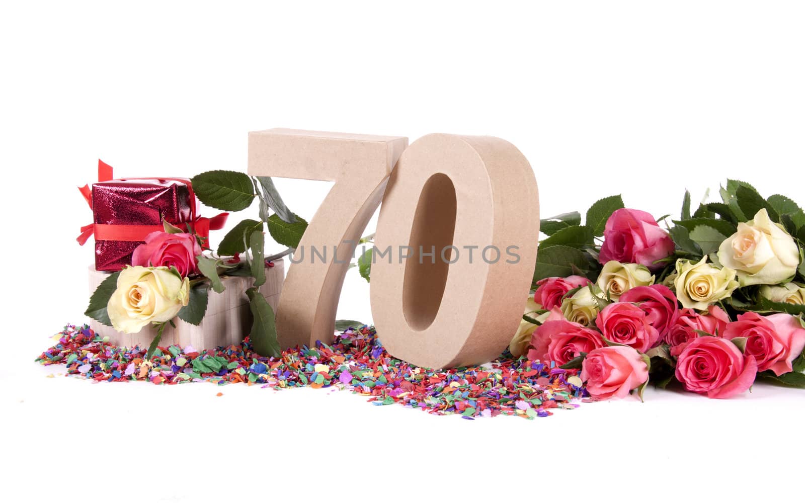 Number of age in a colorful studio setting with fresh roses on a bottom of confetti