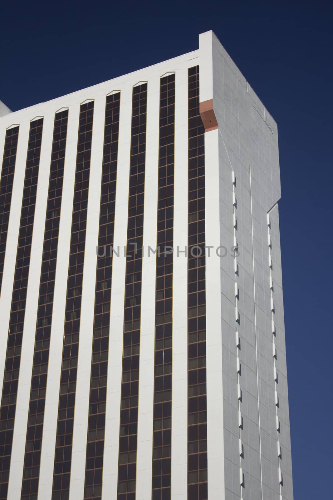 Casino building with blue skies and gold windows. by jeremywhat