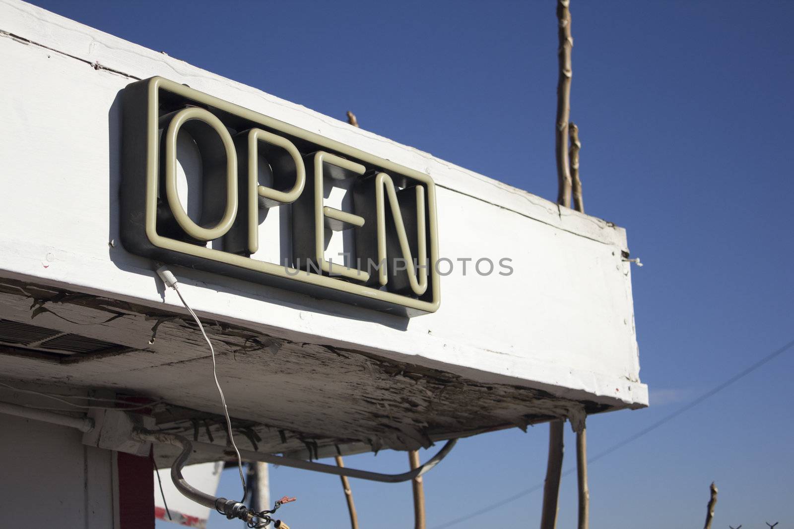 Door for a business with open neon sign by jeremywhat