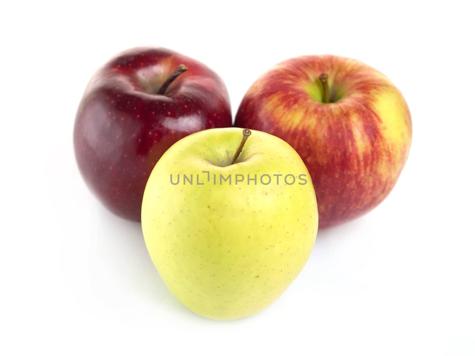 Three apples arranged on a white background
