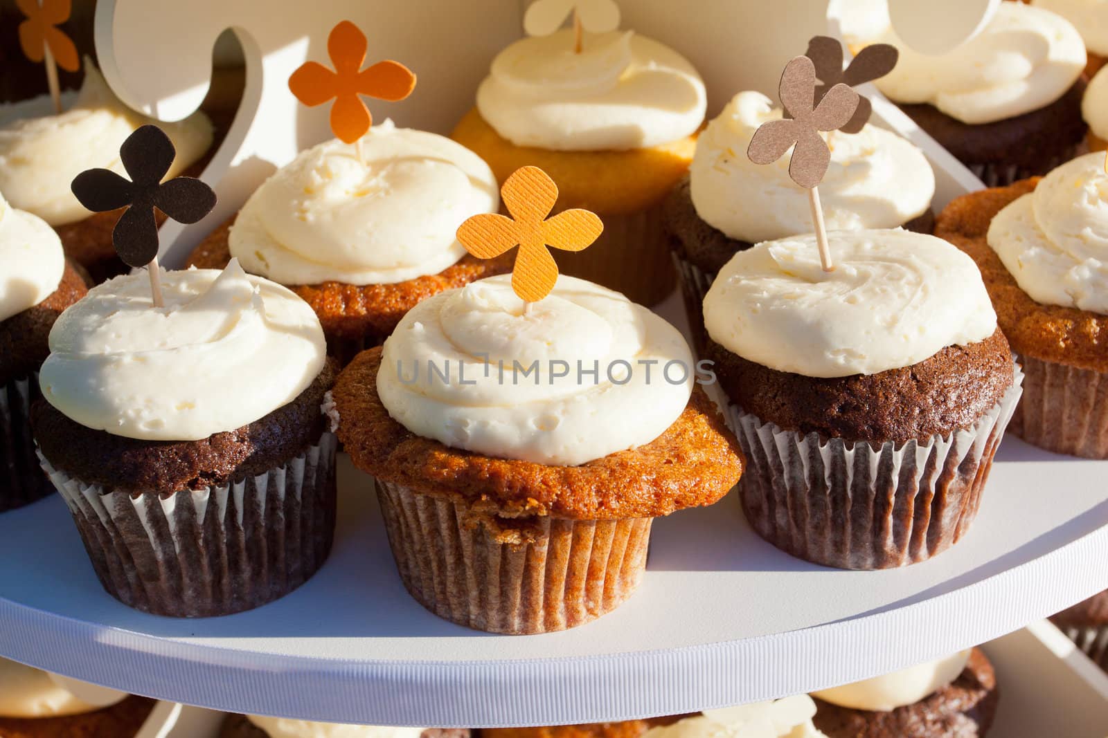 Wedding cupcakes of chocolate, vanilla, and carrotcake at a wedding reception.