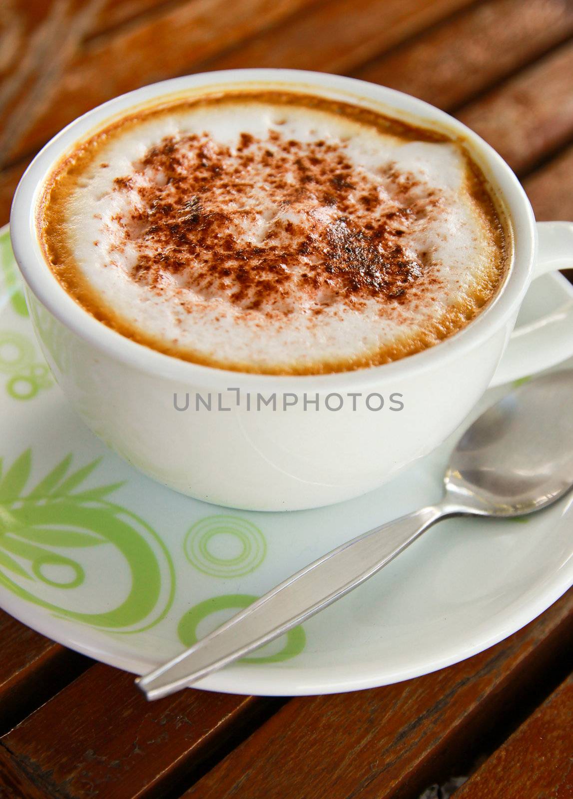 Coffee latte or cappuccino in a cup on wooden background by nuchylee