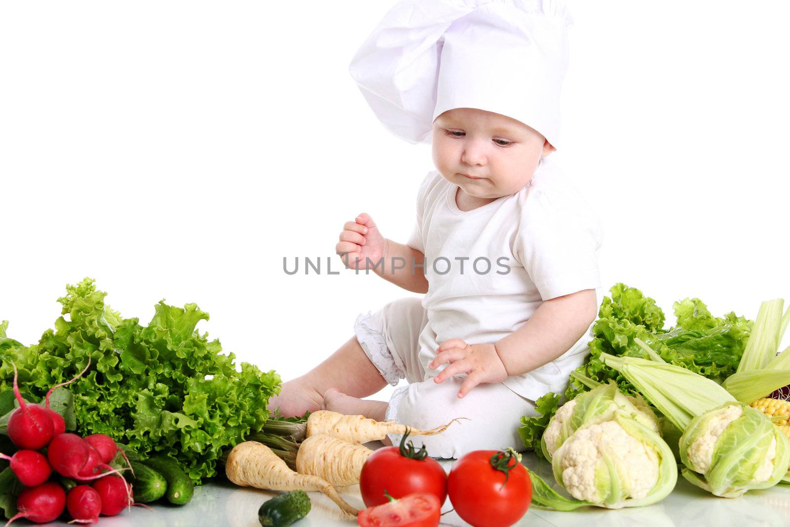 Baby cook with fresh vegetables isolated on a white