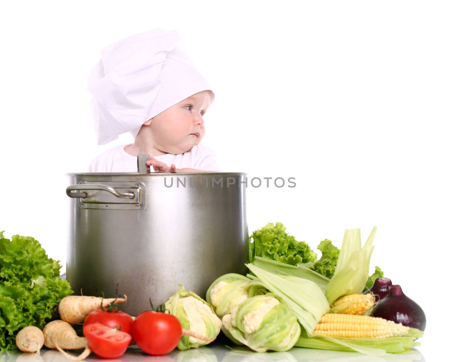 Baby cook with pan and vegetables isolated on a white