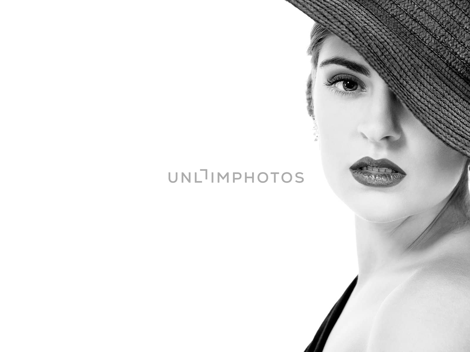 glamour woman with black hat monochrome portrait isolated on white