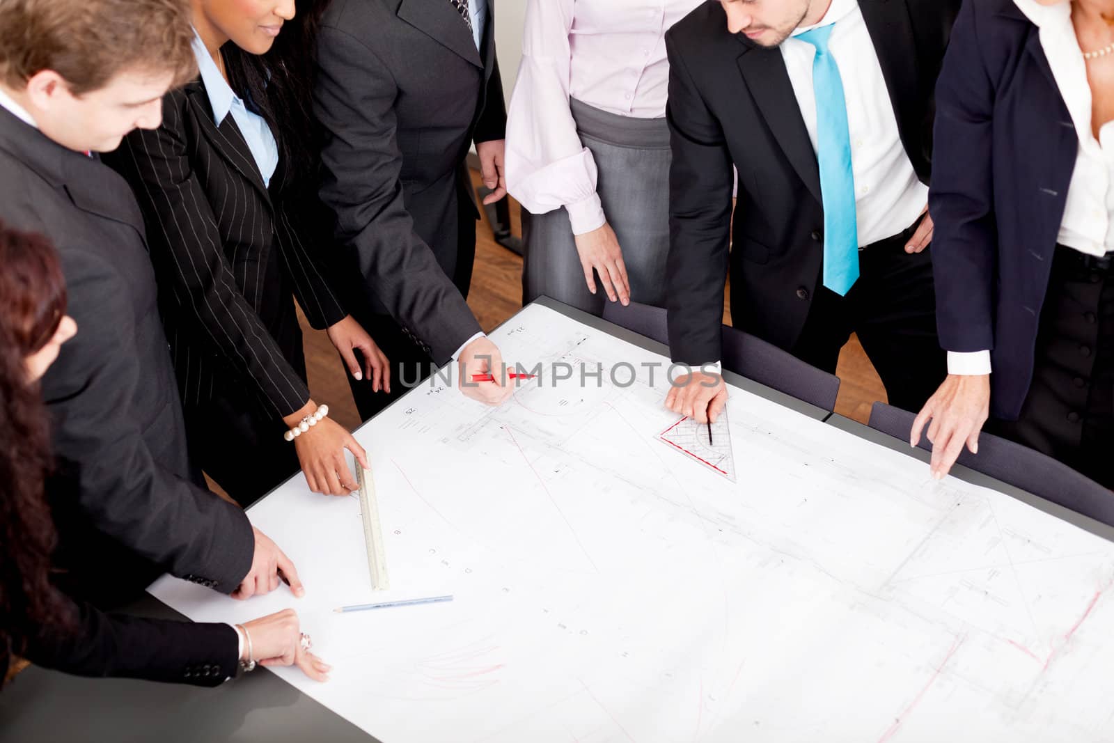 business people discussing architecture plan sketch in office
