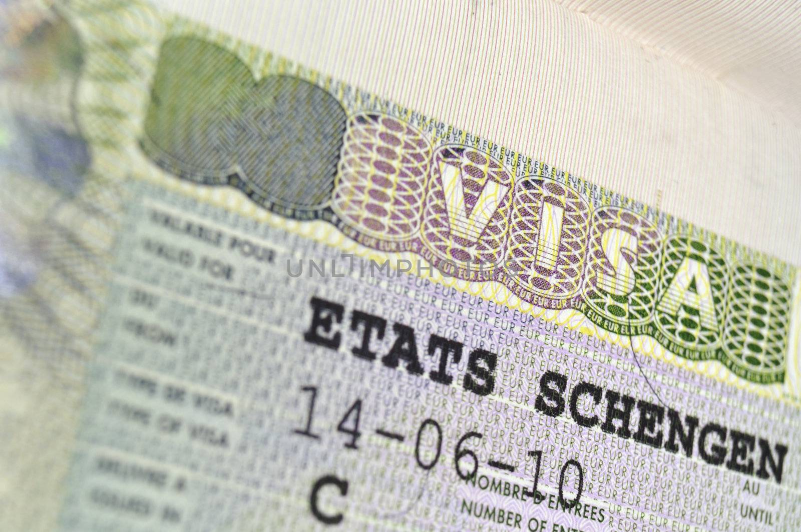 passport page fragment with issued Schengen Visa; focus on VISA word
