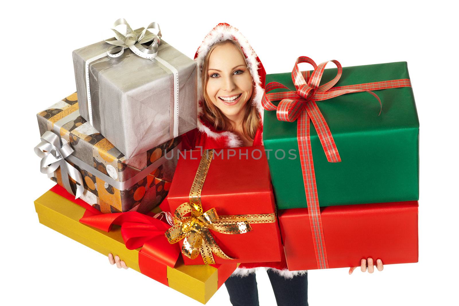 Happy female with christmas costume holding colorful gift boxes, looking up at camera, isolated on white