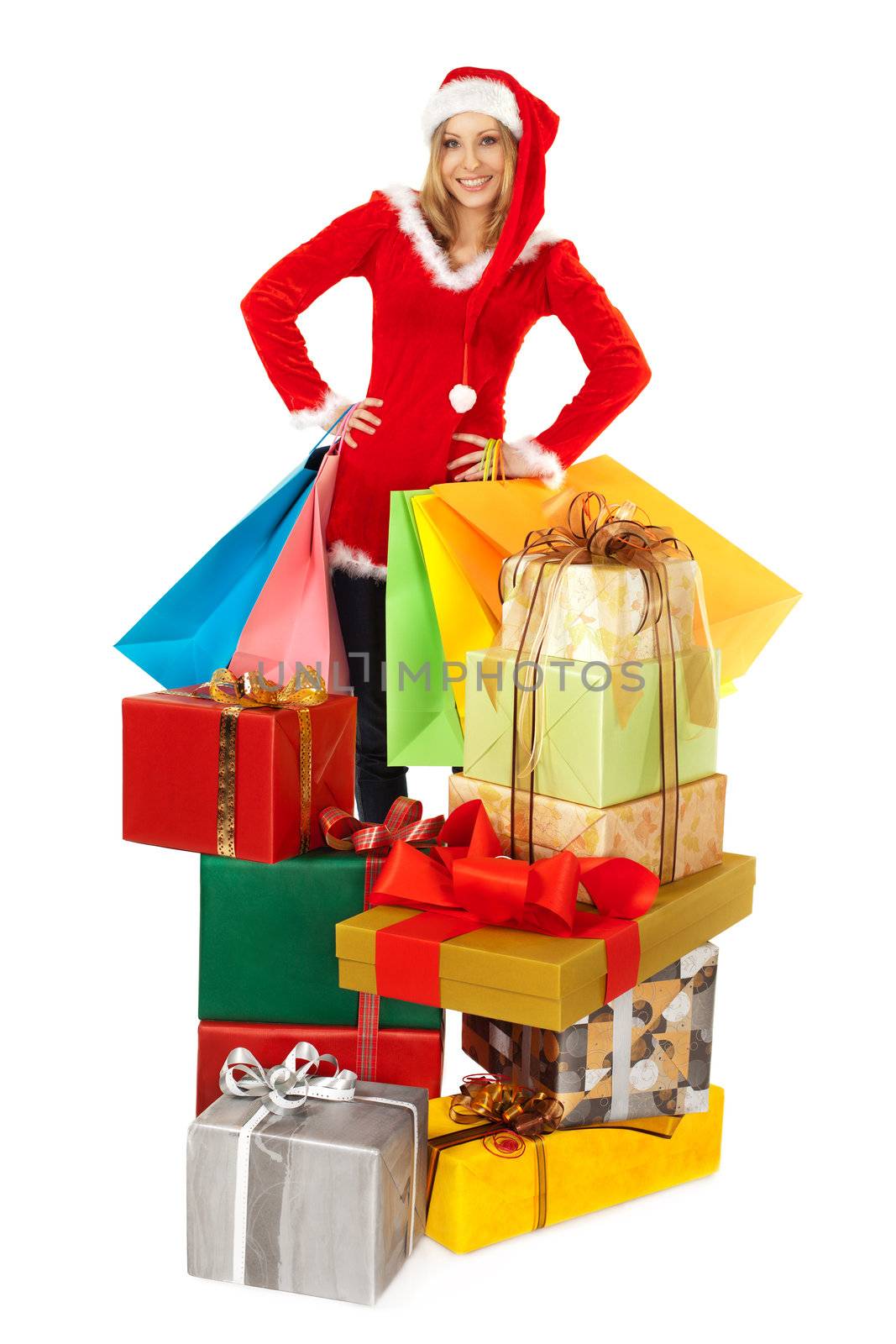 Female standing behind pile of christmas presents by vilevi